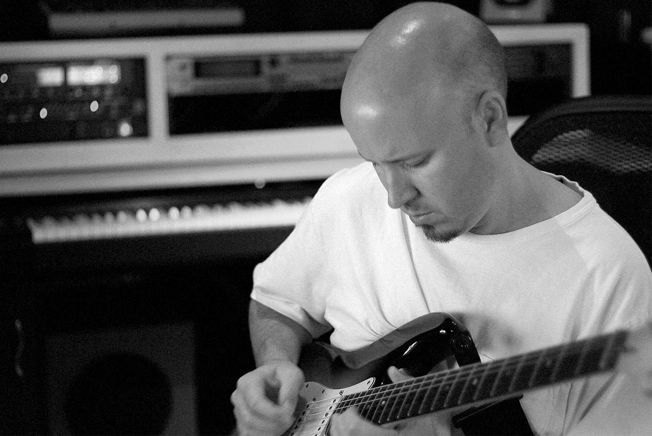 THE CLASSIC SHOT OF DAVID PLAYING THE CUSTOM STRAT FOR THE CROSSING